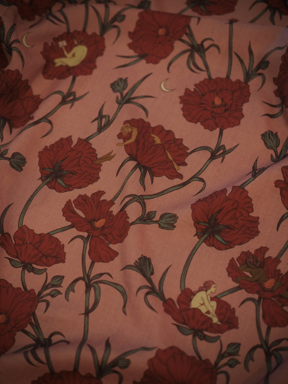 Lightweight eco-friendly Tencel fabric showing print of "The Women who Sleep Among the Flowers" in pink and red (rose) colorway
