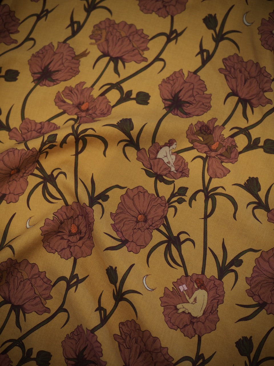 Lightweight eco-friendly Tencel fabric showing print of "The Women who Sleep Among the Flowers" in yellow and pink colorway